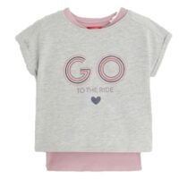 Girl wearing a long-sleeve double-layered graphic t-shirt with unicorn print.